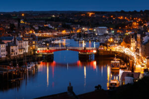 The swing bridge within Whitby harbour, at night