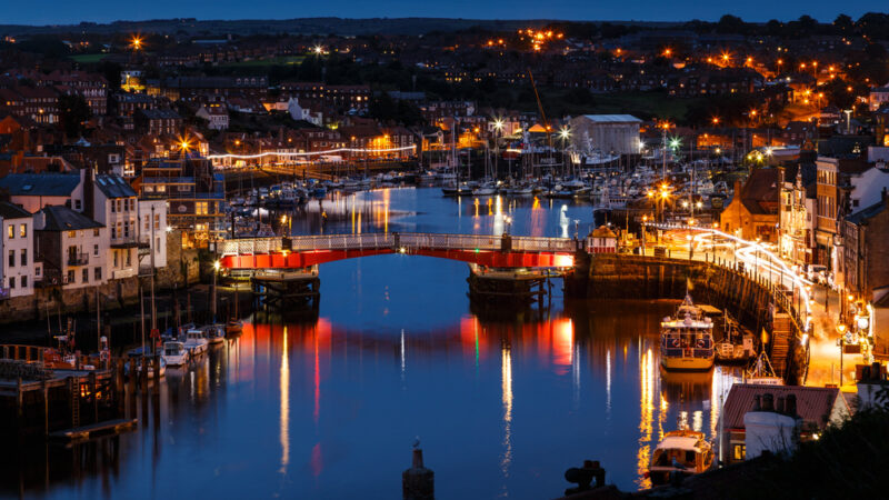 The swing bridge within Whitby harbour, at night