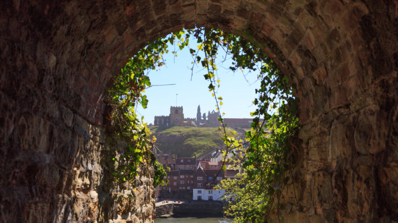 England, North Yorkshire, Whitby. North Sea, East cliff. English Heritage site, ruins of Benedictine abbey, Whitby Abbey, monastery. Inpiration for Caedmon, early English poet and Bram Stoker's gothic tale, Dracula