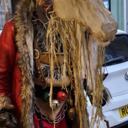 d5340b4c-b8a3-4127-a118-0bea9837e33c A person wearing traditional Krampus outfit for the Krampus Run